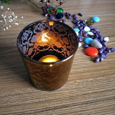 calidad Portadores de velas de vidrio de cobre con patrón de grabado con láser fábrica