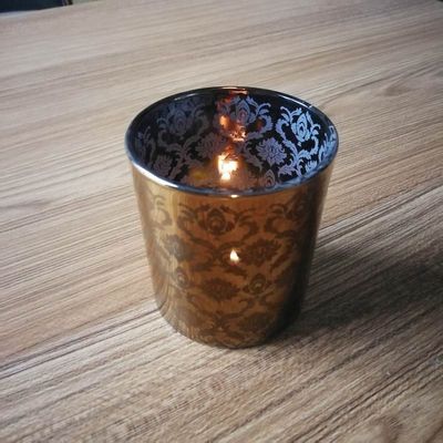 calidad Portadores de velas de vidrio de cobre con patrón de grabado con láser fábrica