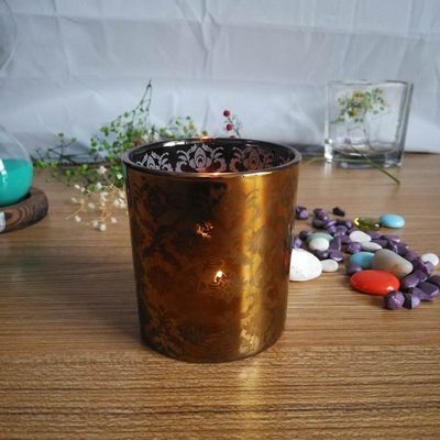 calidad Portadores de velas de vidrio de cobre con patrón de grabado con láser fábrica