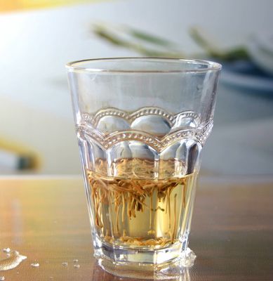 calidad Tumba de vidrio de 10 oz sin tallo con tangente múltiple en relieve fábrica