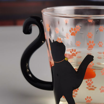 calidad Taza de vidrio de té de gato negro de borosilicato con mango de cola de color fábrica